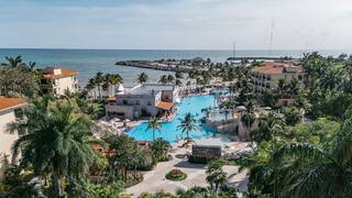 Pool beside resort building with balconies